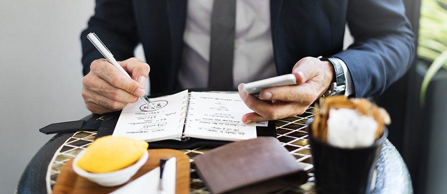 Cropped Businessman Writing Notes Journal Concept