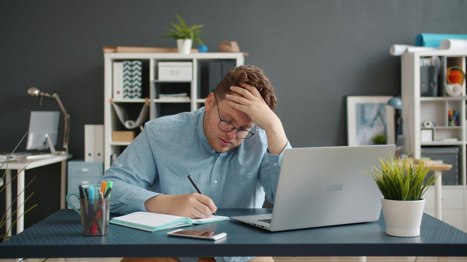 Business professional feeling overwhelmed by social media content creation.